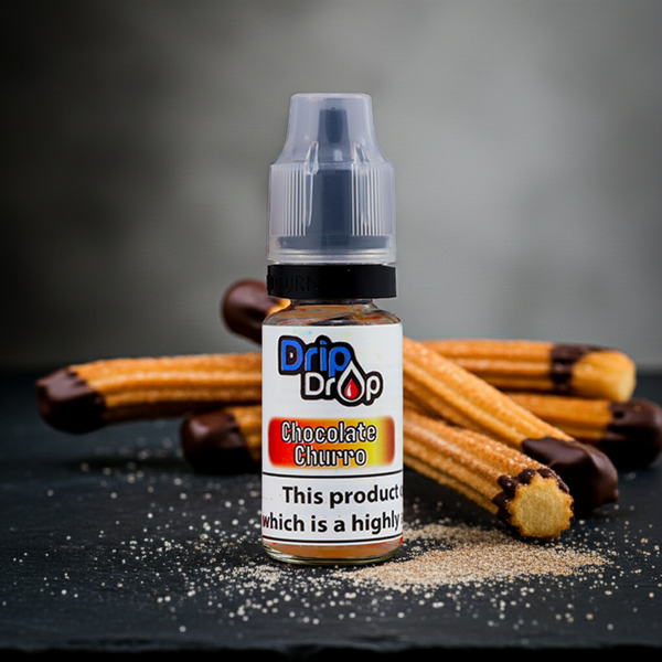 Bottle of Drip Drop Chocolate Churro flavor vape juice with churros on a dark surface.